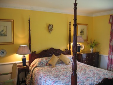The Byre Suite - Bedroom with mahogany four-poster bed - larger image